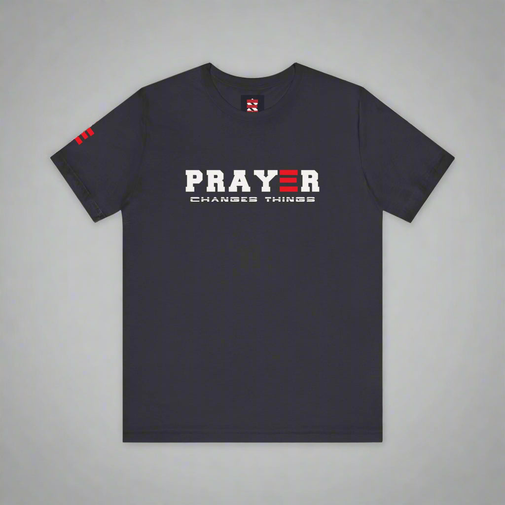 Dark grey t-shirt with 'PRAYER CHANGES THINGS' text on a gray background