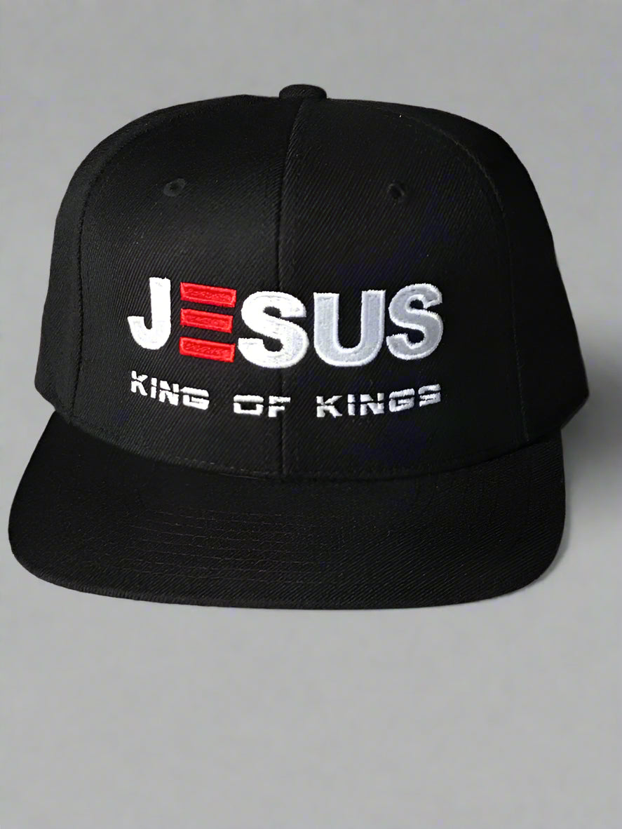 Black cap with 'JESUS KING OF KINGS' text on a light background