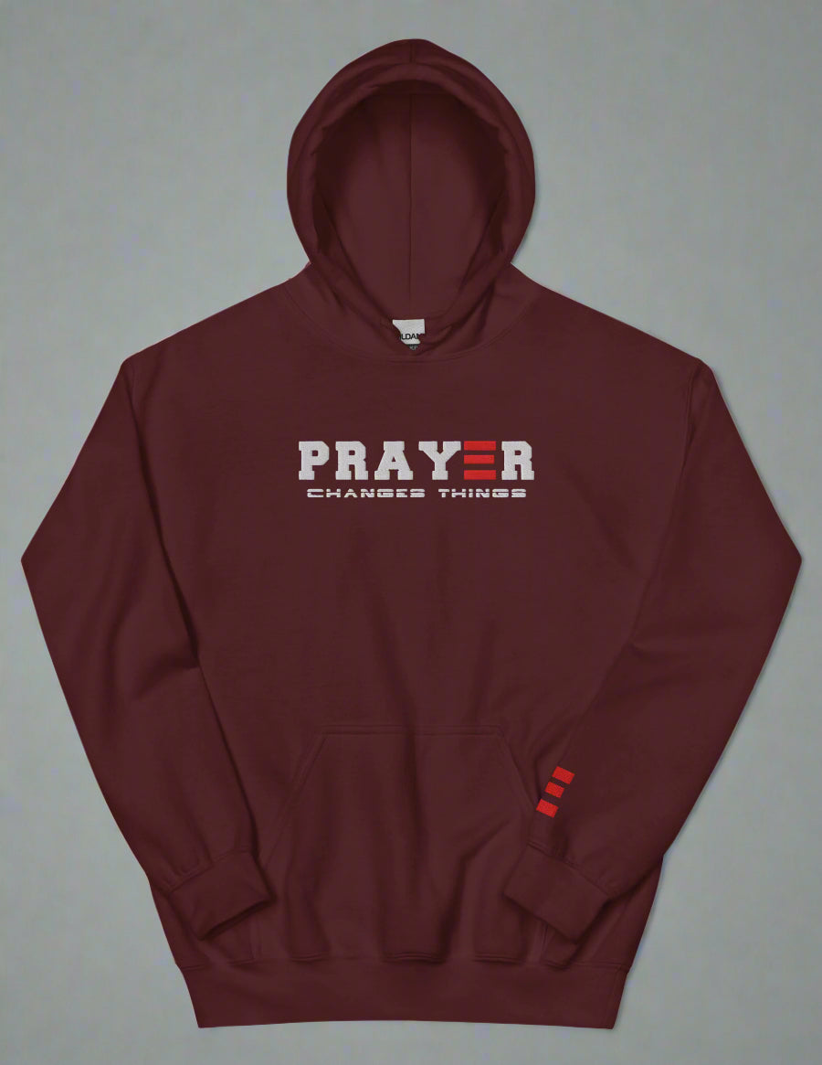 Maroon hoodie with 'PRAYER CHANGES THINGS' text on a white background