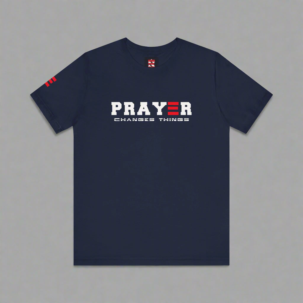 Navy blue t-shirt with 'PRAYER CHANGES THINGS' text on a gray background