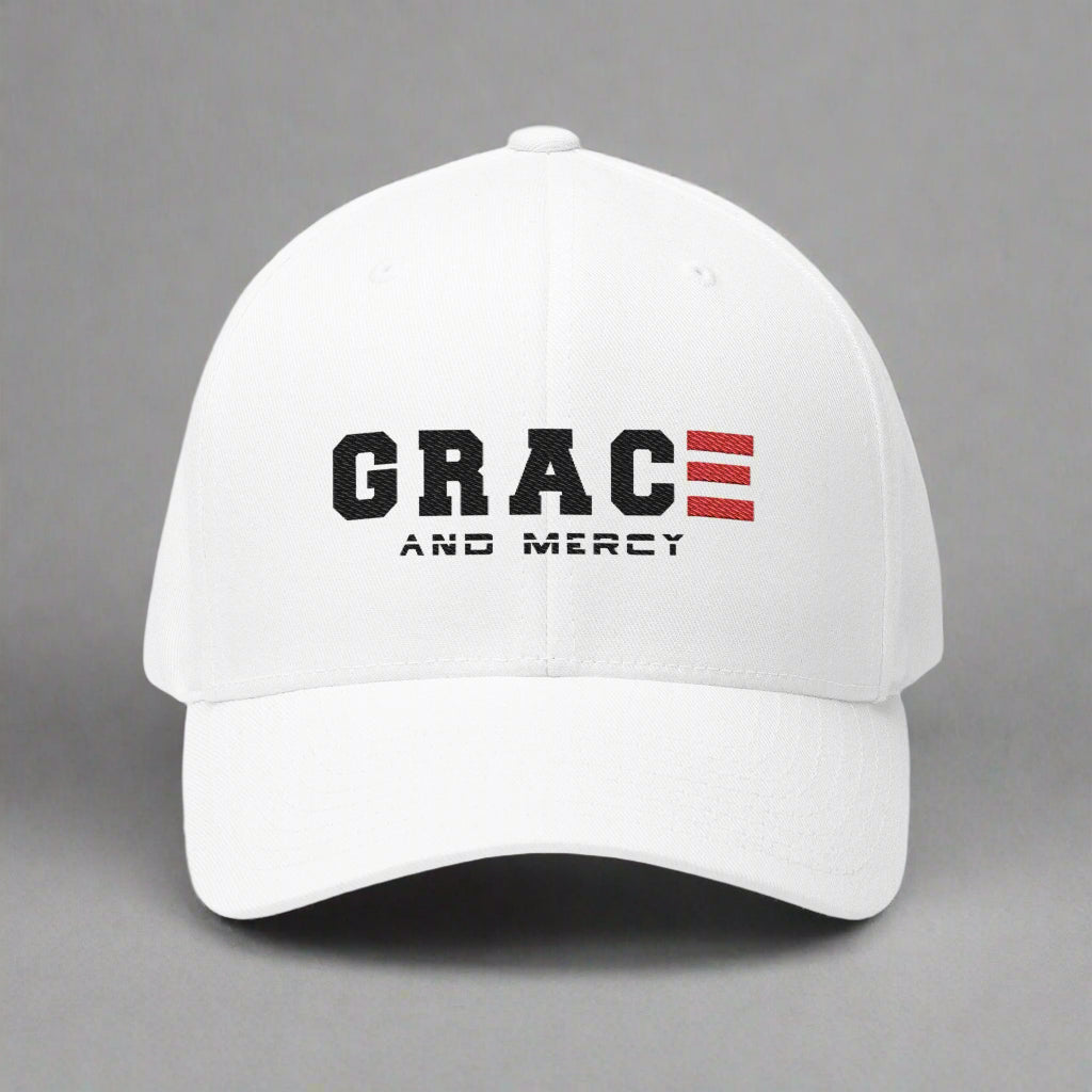 White cap with GRACE AND MERCY text on a gray background