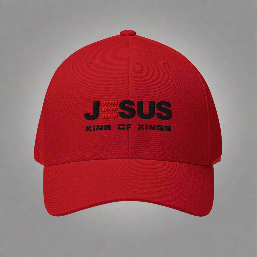 Red cap with black text 'JESUS KING OF KINGS' on a white background