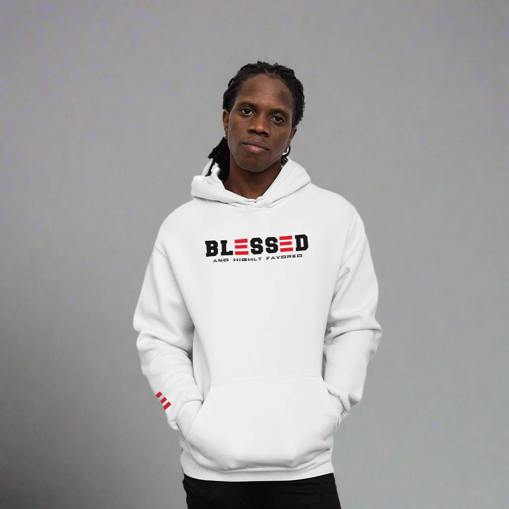 Person wearing a white hoodie with 'Blessed and Highly Favored' text on a  grey  background