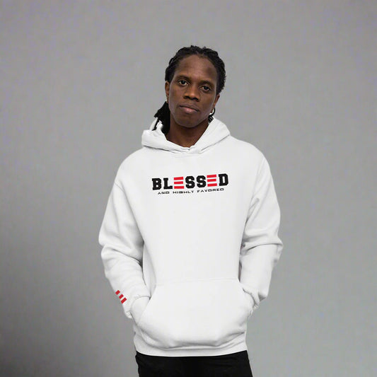 Person wearing a white hoodie with 'Blessed and Highly Favored' text on a  grey  background