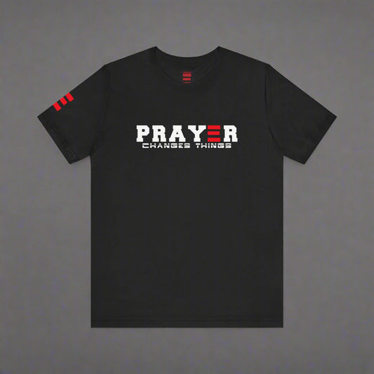 Black t-shirt with 'PRAYER CHANGES THINGS' text on a gray background