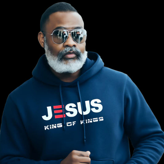 Man wearing a blue hoodie with 'JESUS KING OF KINGS' text on a black background

