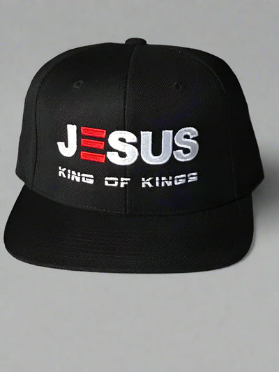 Black cap with 'JESUS KING OF KINGS' text on a light background
