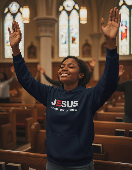 Navy blue hoodie with 'Jesus King of Kings' text on a gray background