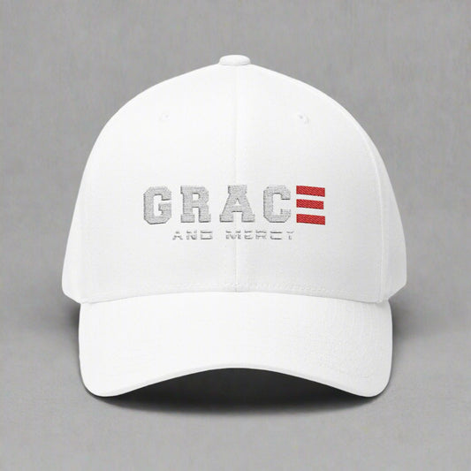 White cap with 'GRACE AND MERCY' text and red logo design on a grey background