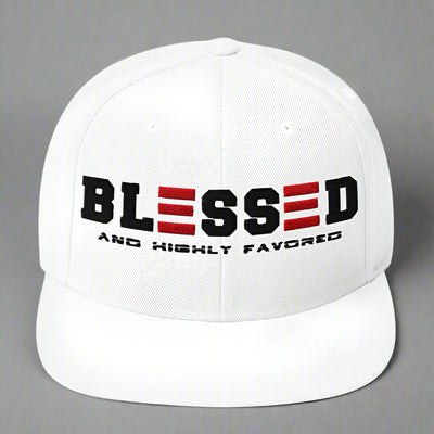 White cap with 'BLESSED AND HIGHTLY FAVORED' text on a white background