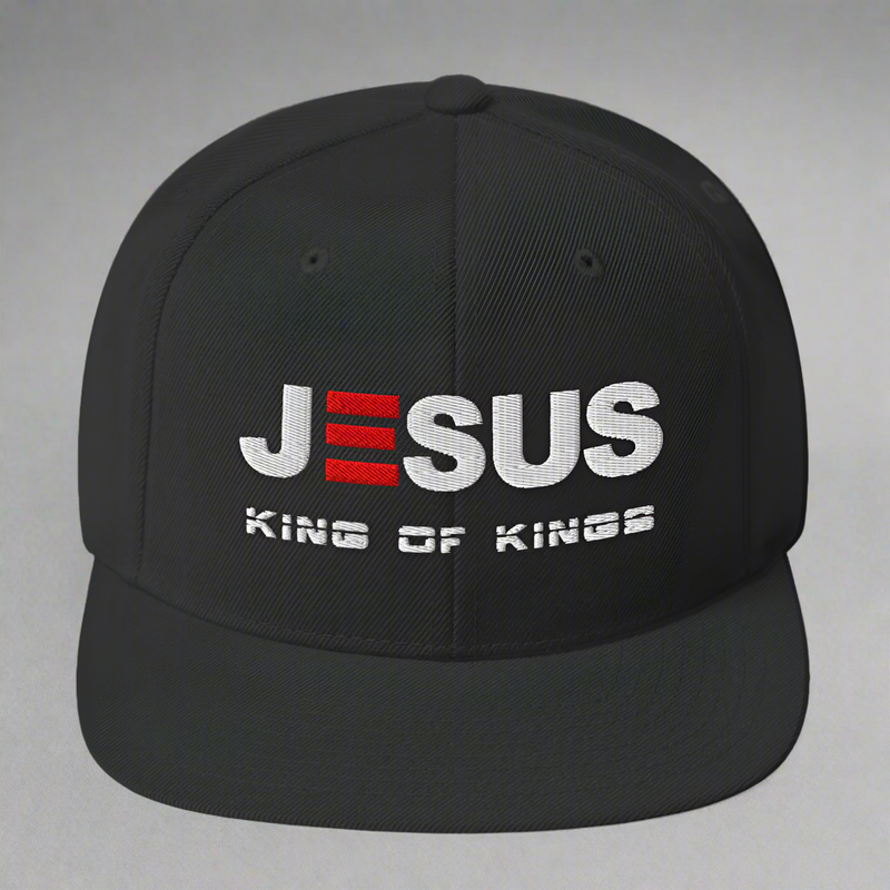 Black cap with 'Jesus King of Kings' text on a white background