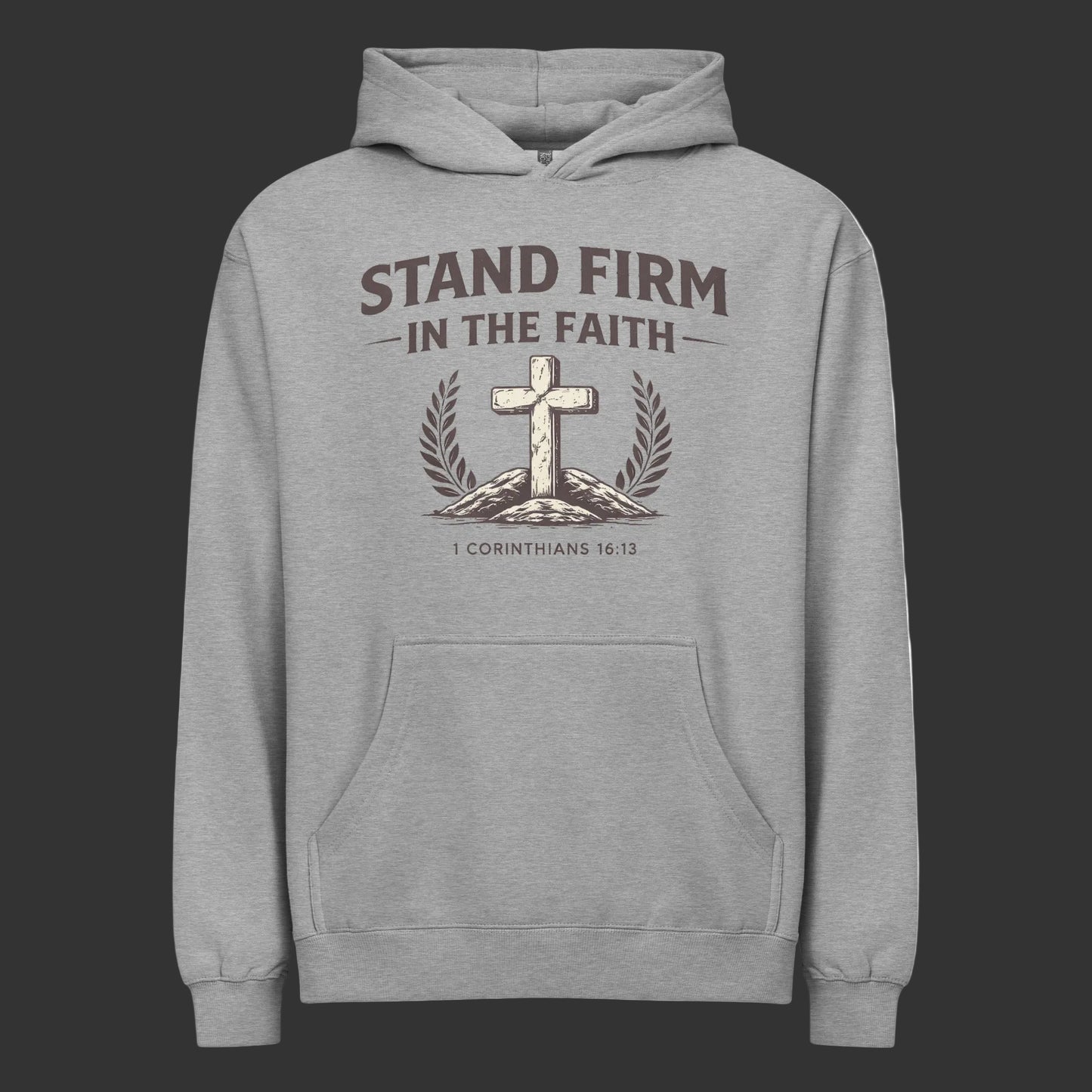 Gray hoodie with cross and laurel wreath design and text 'Stand Firm in the Faith' on a black background